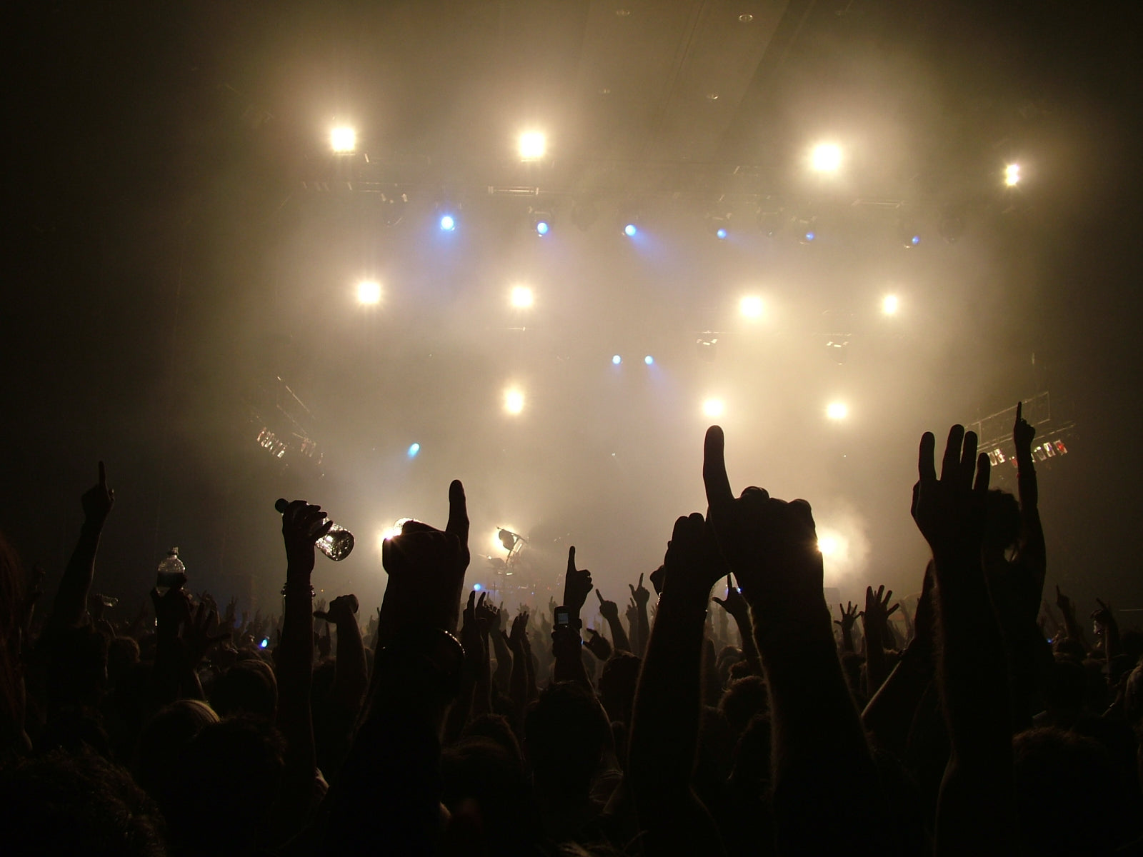 Band on stage with lights on