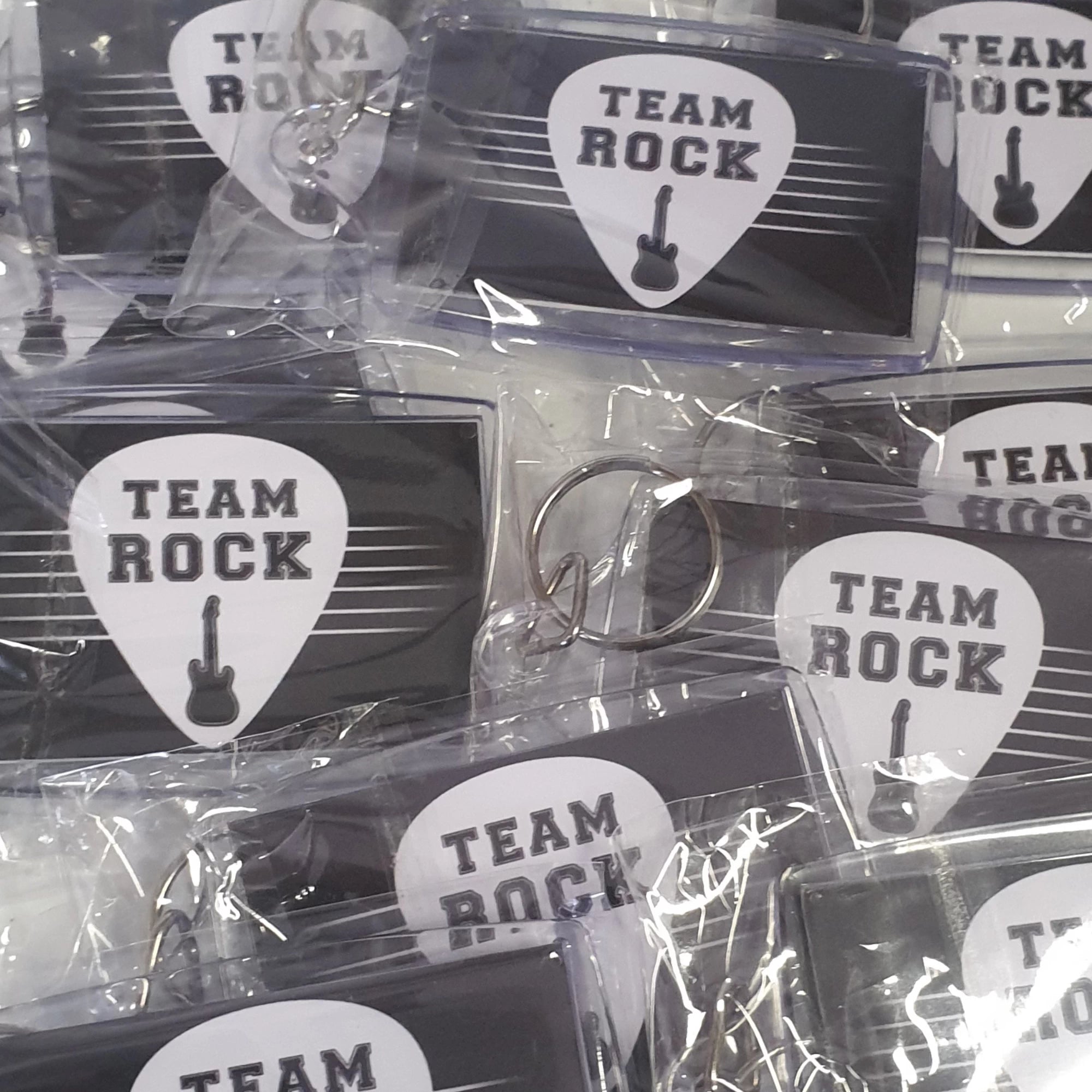 Keyrings with 'Team Rock' design in clear packaging