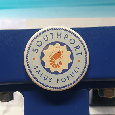 Customised magnet with a business logo, perfect for promotional items.