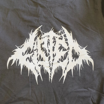 White abstract design on a dark gray fabric background