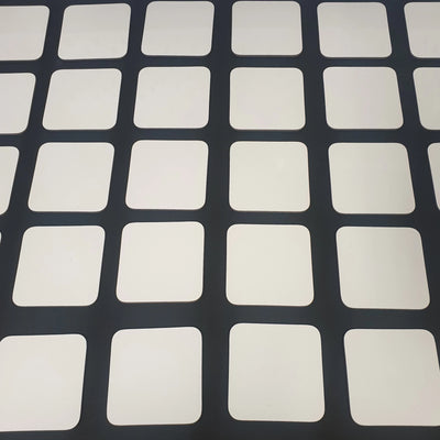 White coasters for artists waiting to be decorated with their artwork.