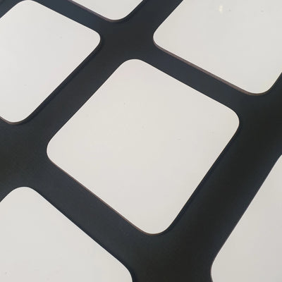 White custom coasters ready to be customised with artwork.