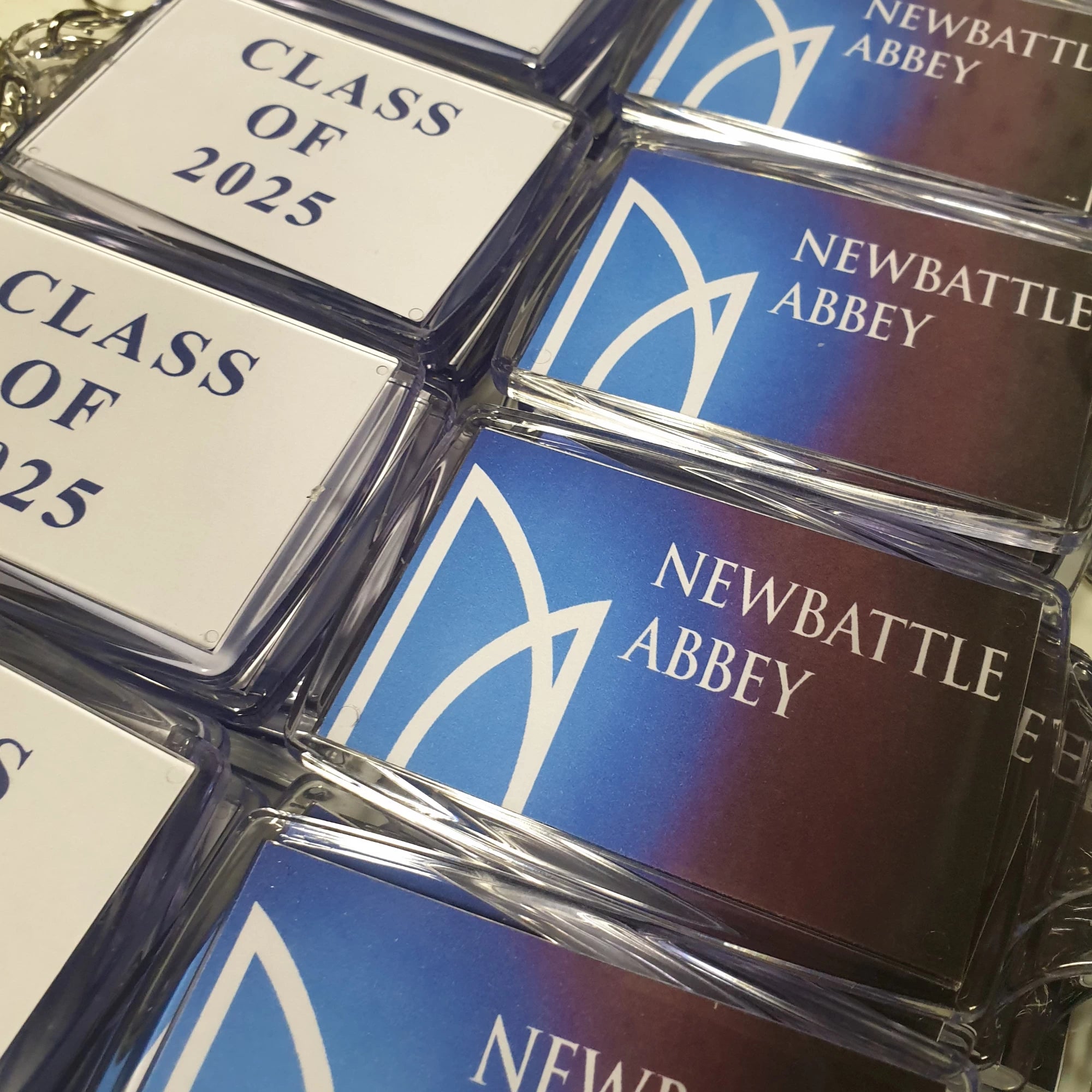Collection of Newbattle Abbey college keyrings with 'Class of 2025' text.