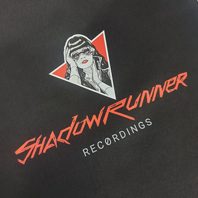 Shadowrunner recordings logo close up, on a black tote bag.