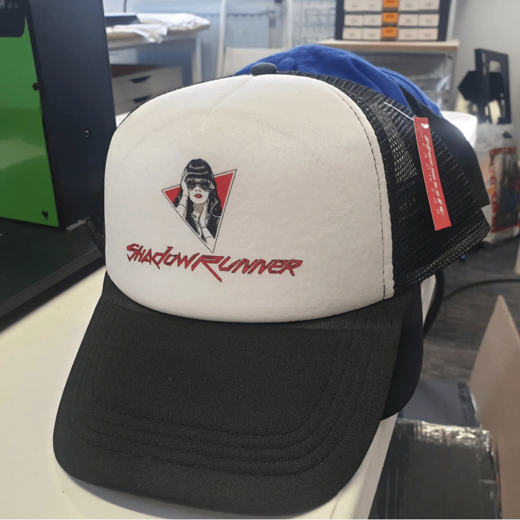 Shadowrunner Recordings black logo trucker cap.