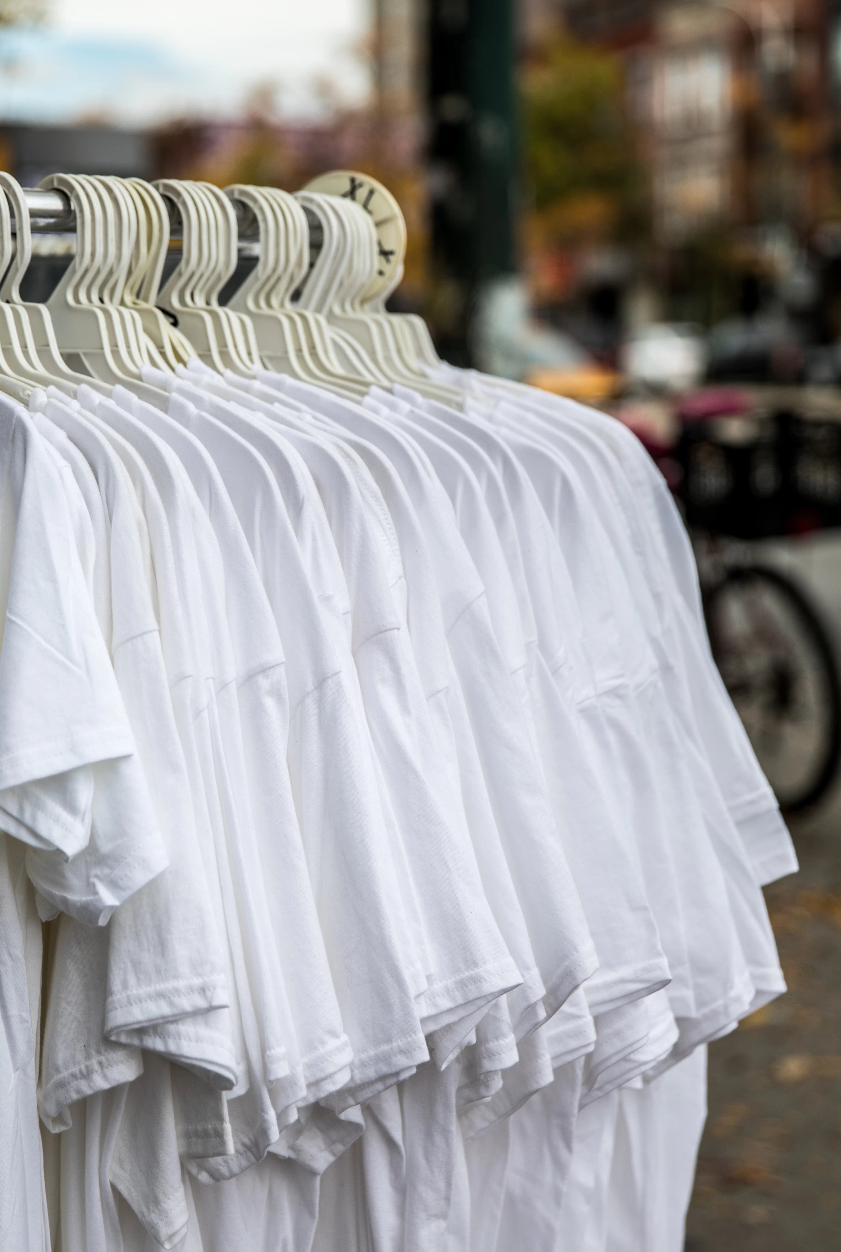 White Shirts on a clothing rack.