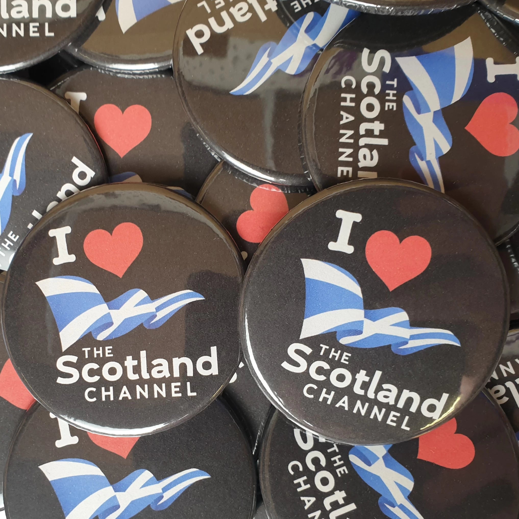 The Scotland Channel 59mm custom badges with Saltire flag and love heart.